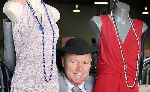 Darren Everard shows off some party dresses from the Salvation Army op shop in Pialba. Darren Everard shows off some party dresses from the Salvation Army op shop in Pialba.
